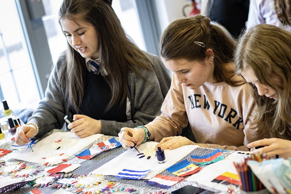 Girls create Eurovision inspired nail art at a workshop in Runcorn