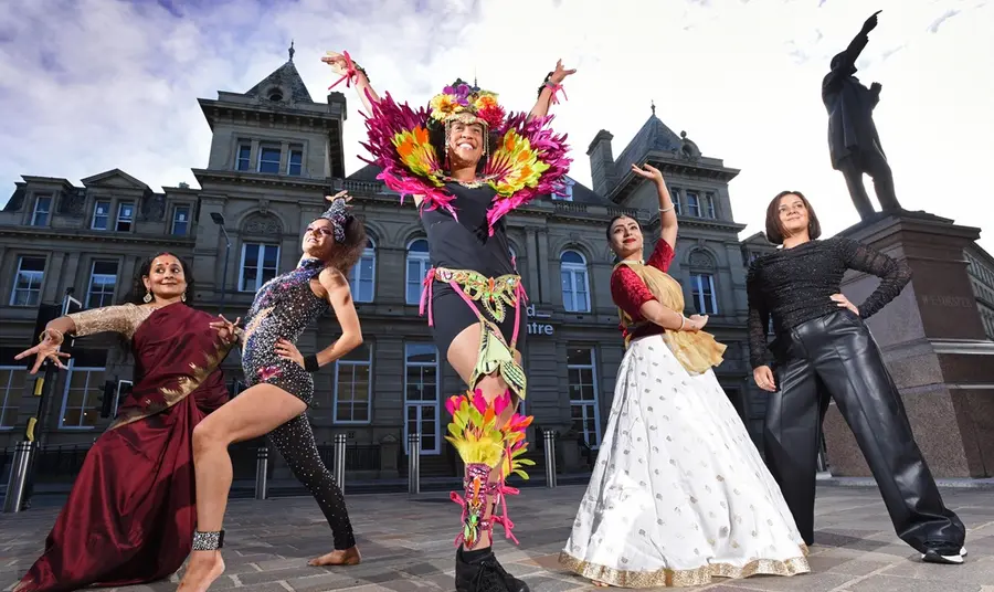 Five dancers strike a pose outside Bradford Arts Centre.