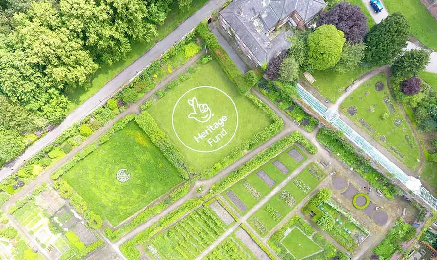 An aerial view of The National Lottery Heritage Fund's acknowledgement stamp on Croxteth Hall's lawn. 