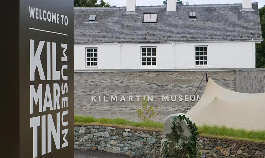 The exterior of Kilmartin Museum, a historic white building with a slate roof