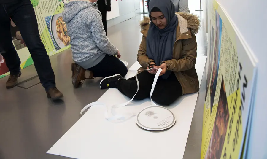 Young people working on the exhibition