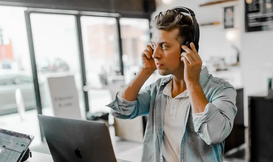 Man with headphones and computer