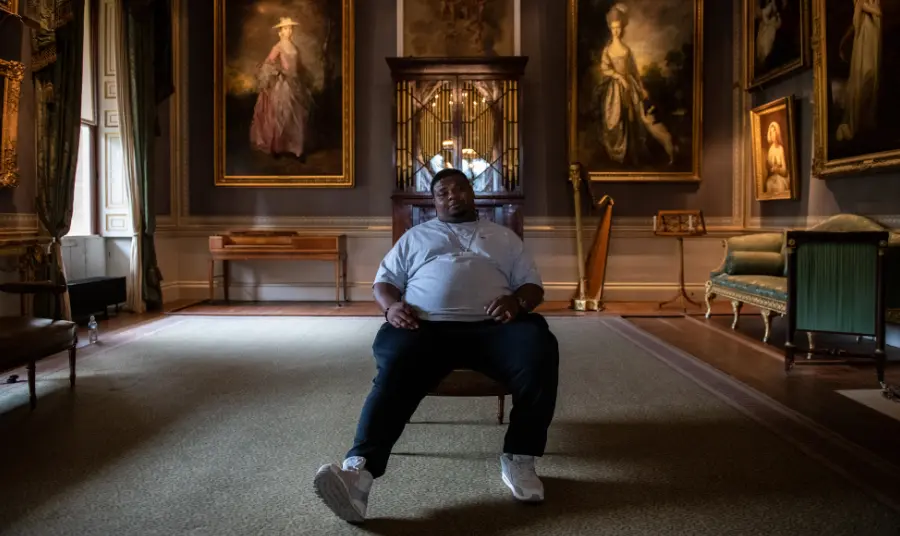 Big Narstie sitting in Kenwood House