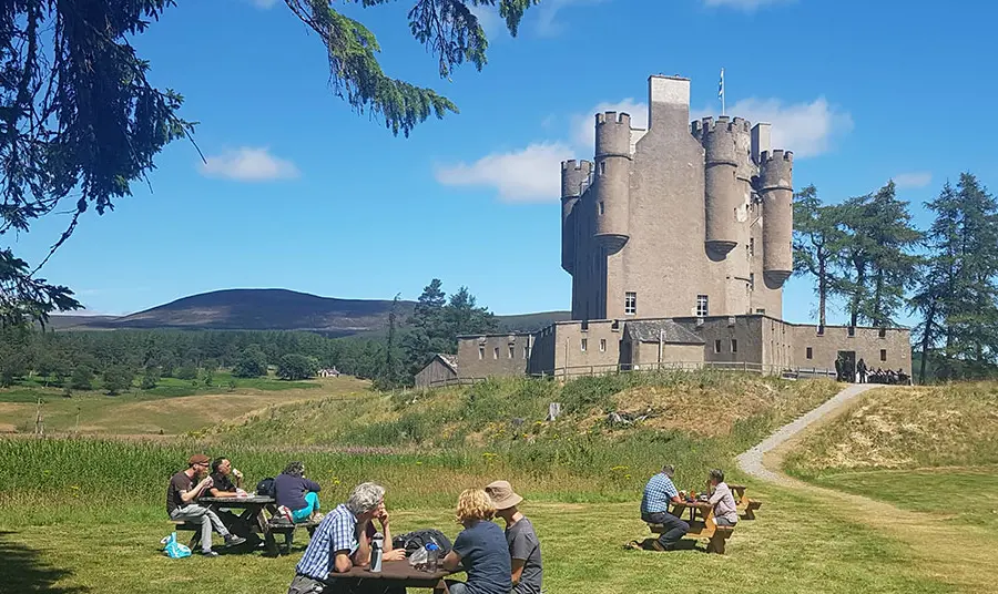 Visitors having picnics outside of Braemar Castle 