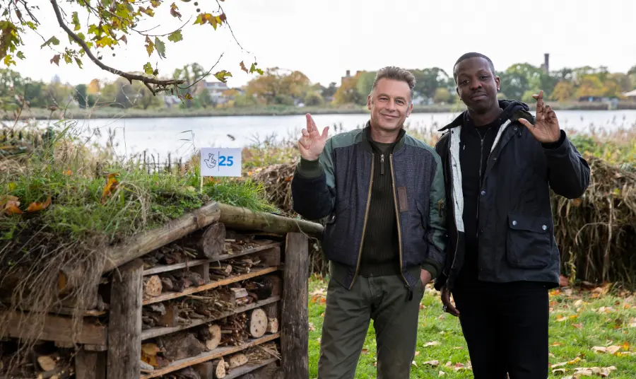 Chris Packham and Jamal Edwards crossing their fingers like the National Lottery logo