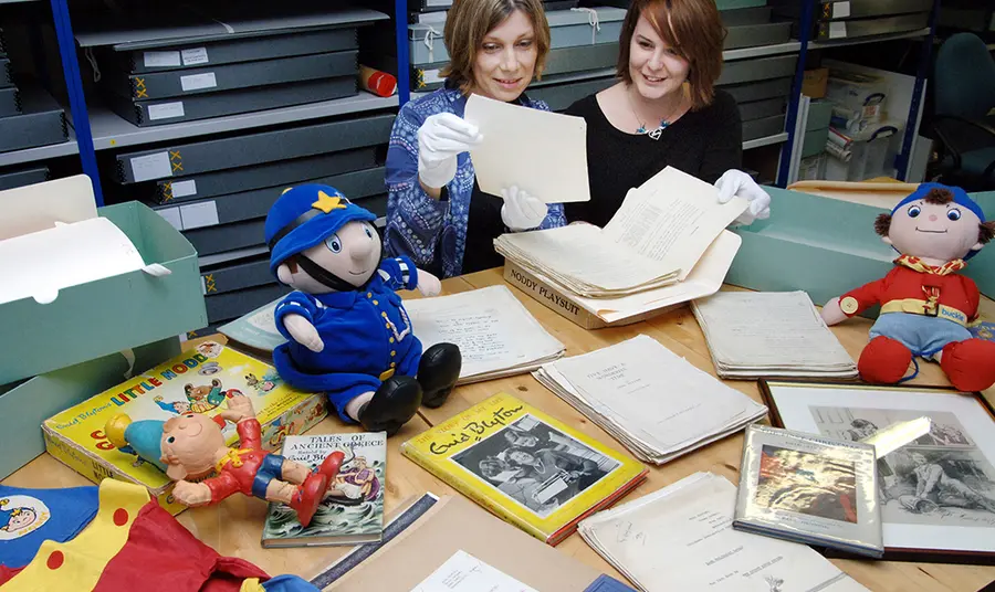 Collections Director Sarah Lawrance and Exhibition Manager Alison Fisher with Enid Blyton archive