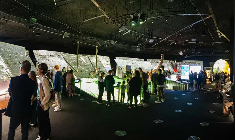 People inside building looking at exhibits