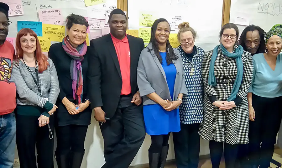 A line of people smiling