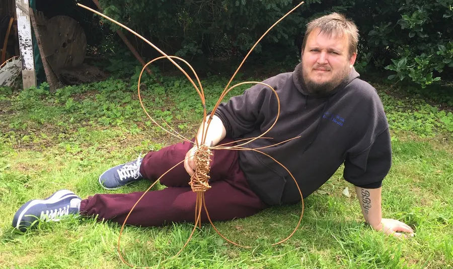 Man lying with artwork