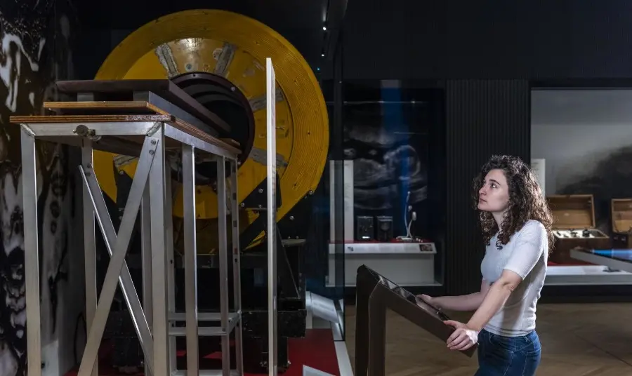 Girl looking at old MRI machine