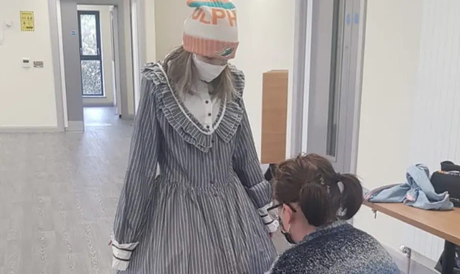 Person getting costume fitted