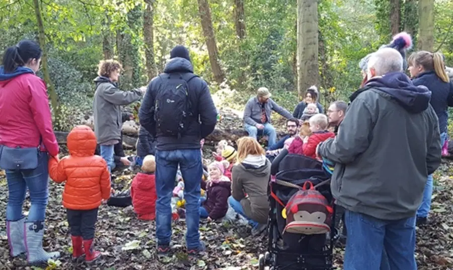 Parents and children in a wood