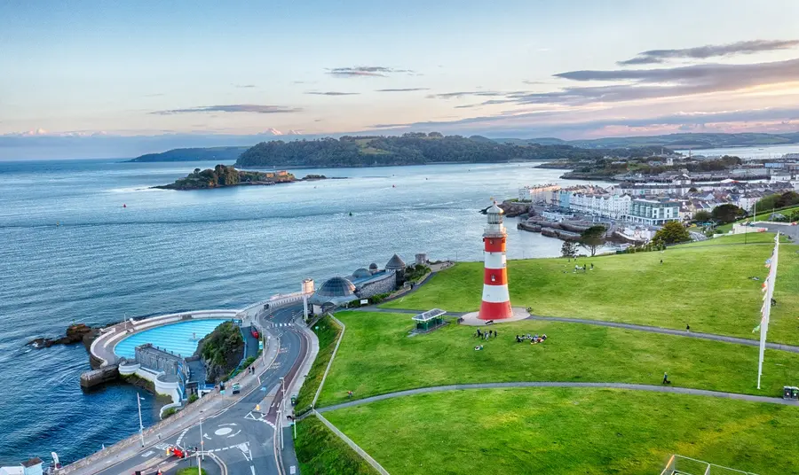 Aerial view of Plymouth's coast, with the lighthouse and lido in view