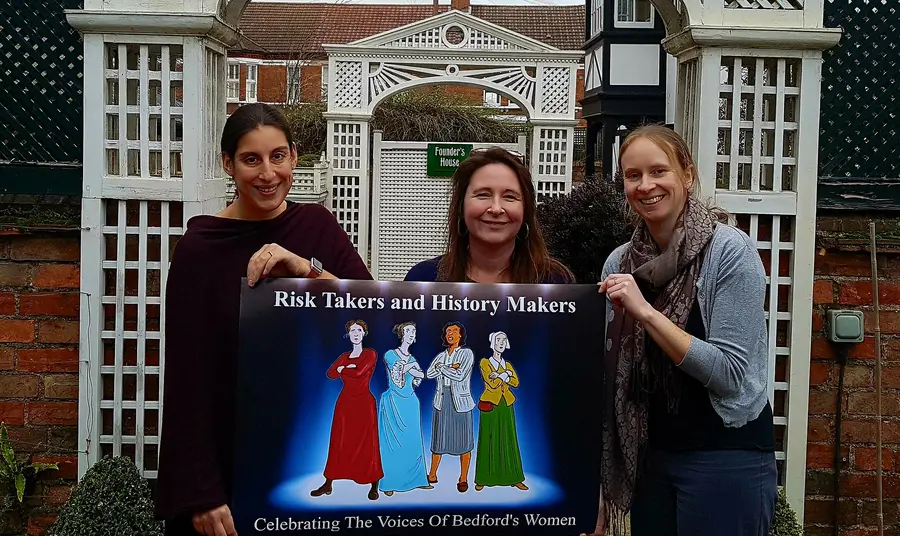 Women holding a sign