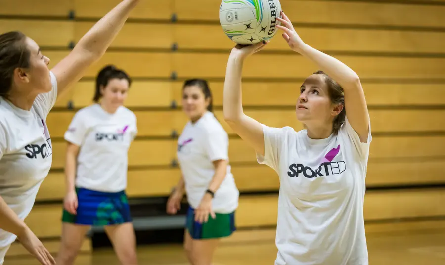 Young people playing netball