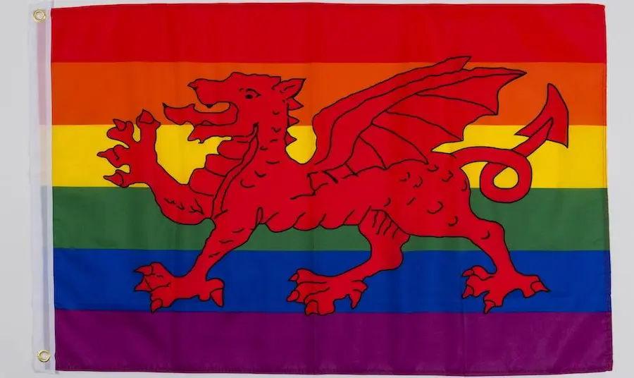 A national Welsh flag with rainbow background.