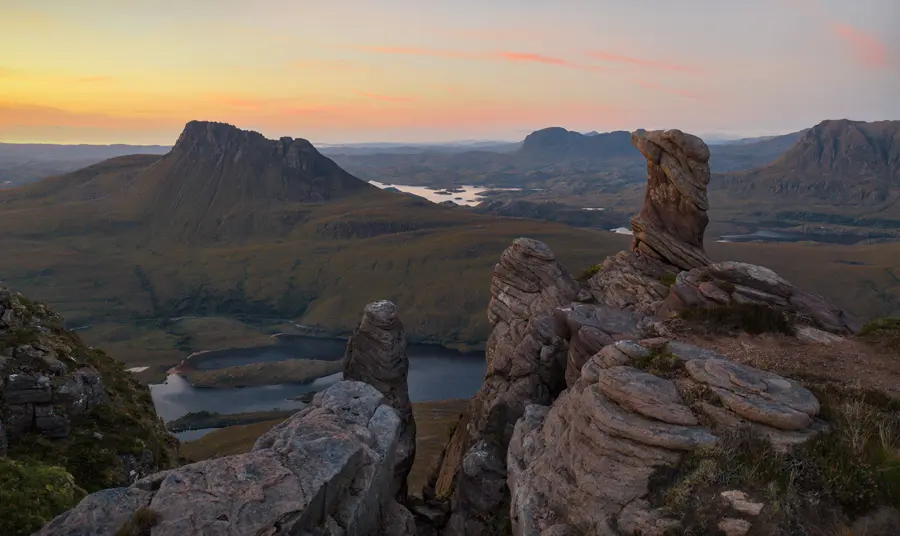 Rugged landscape at sunset including mountains and jagged rocks in the Scottish uplands