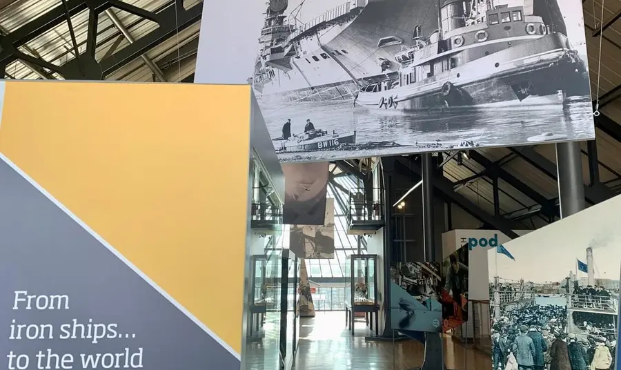 Banners and historic photographs inside the Shipbuilders Gallery.