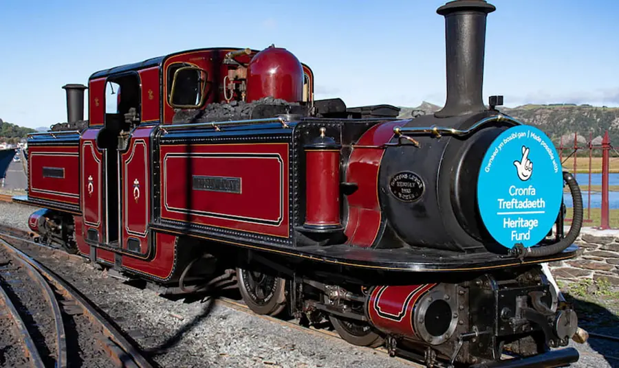 A steam train with The National Lottery Heritage Fund acknowledgement stamp on the front