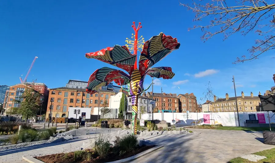 A colourful sculpture of an hibiscus flower