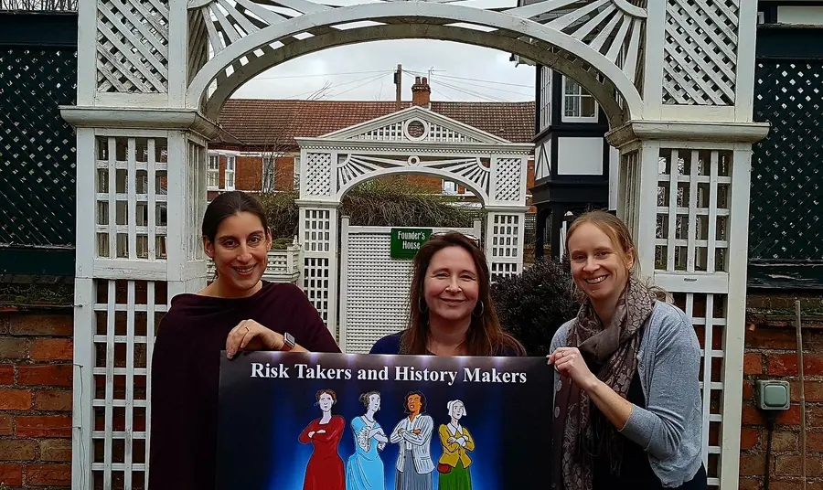 Women holding a sign
