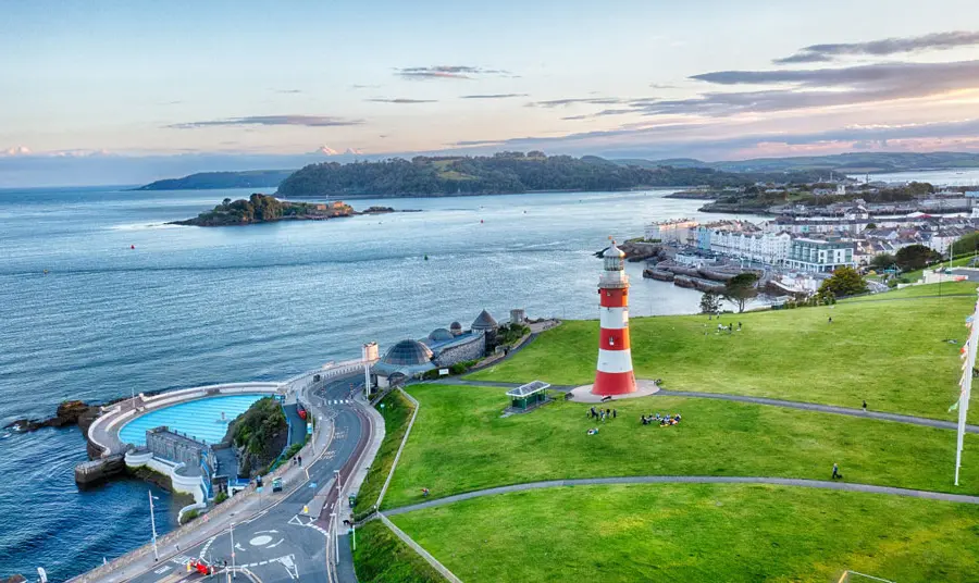 Aerial view of Plymouth's coast, with the lighthouse and lido in view