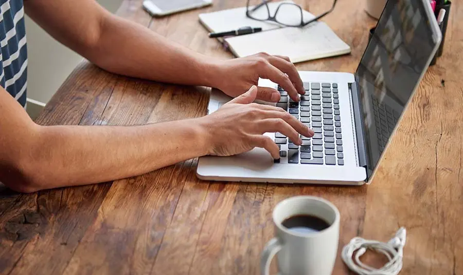 Man typing on laptop