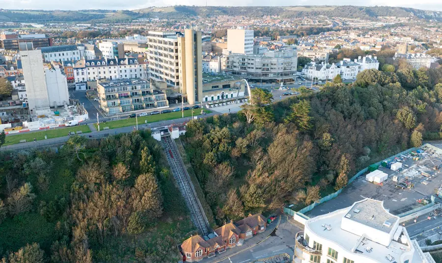 An aerial view of Leas Lift on the cliff edge with town buildings above