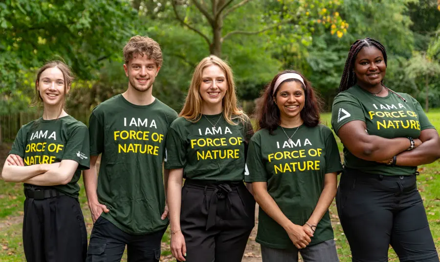 Five young people stand side by side wearing t-shirts that say 'we are a force of nature'