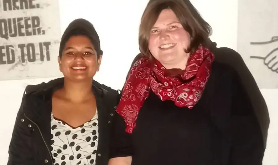 Two women at queer exhibition