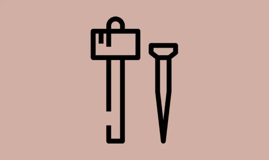 An icon of a hammer and chisel