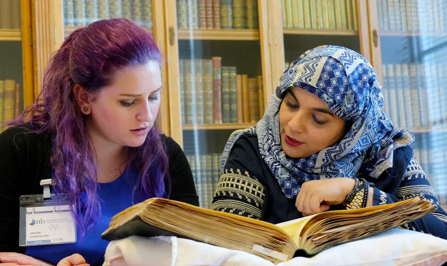 Young participants carrying out research at the National Library of Scotland