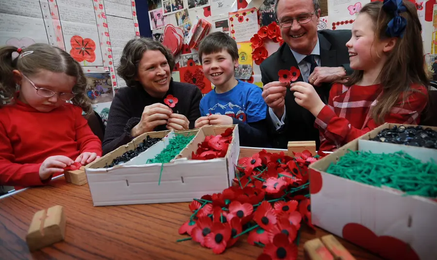 Children and adults making poppies