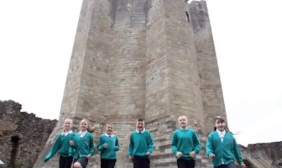 Pupils from Morley Place Junior School help celebrate the reopening of the revamped Conisbrough Castle. Photo Kippa Matthews