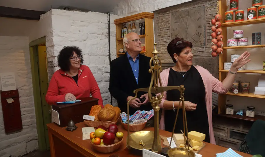 HLF Chief Executive Ros Kerslake chats to volunteers at Mr Ibbit's 1917 shop in Bacup Natural History Museum