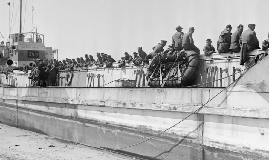 German prisoners await passage to England in a Landing Craft Tank