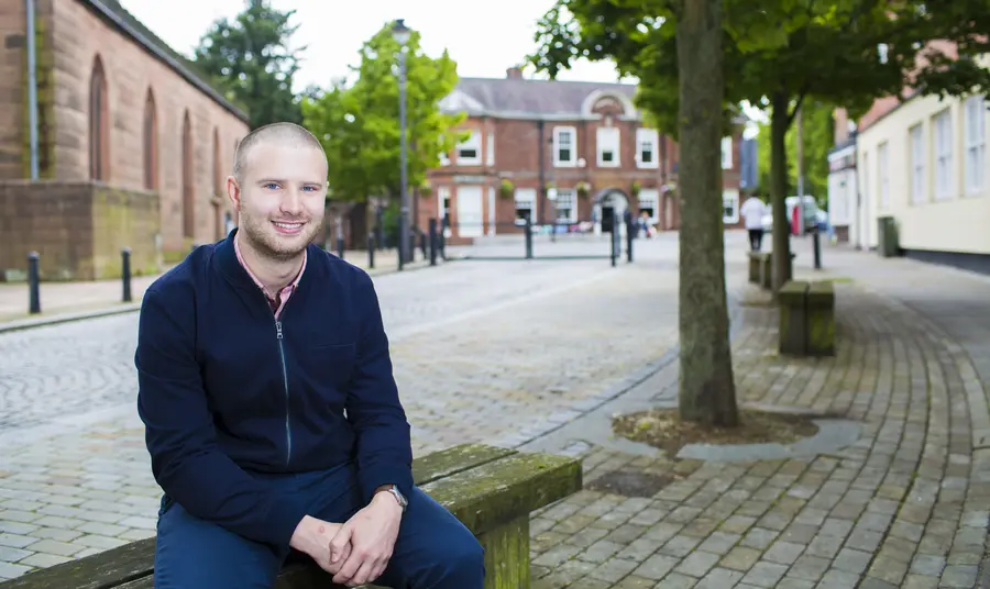 Daniel Longman sitting on a bench