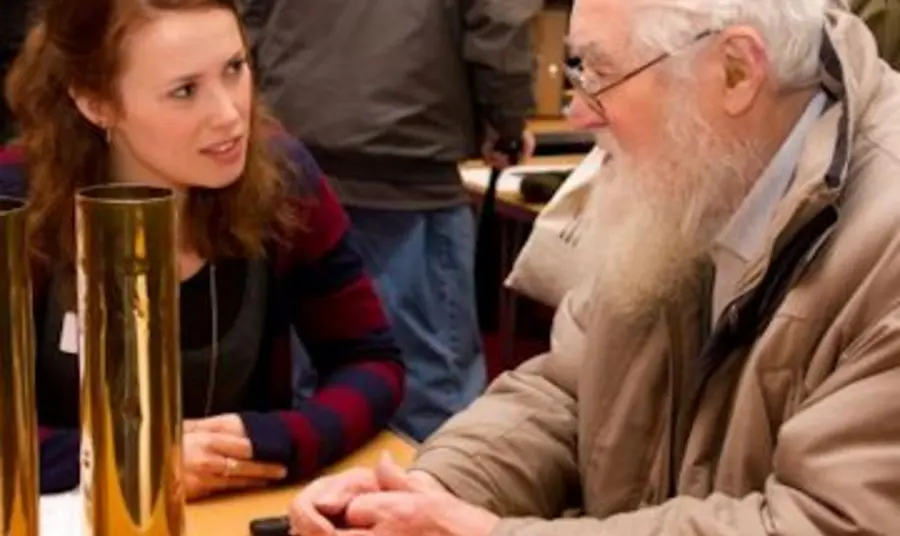 Discussing artefacts at the First World War Road Show, Morley Town Hall