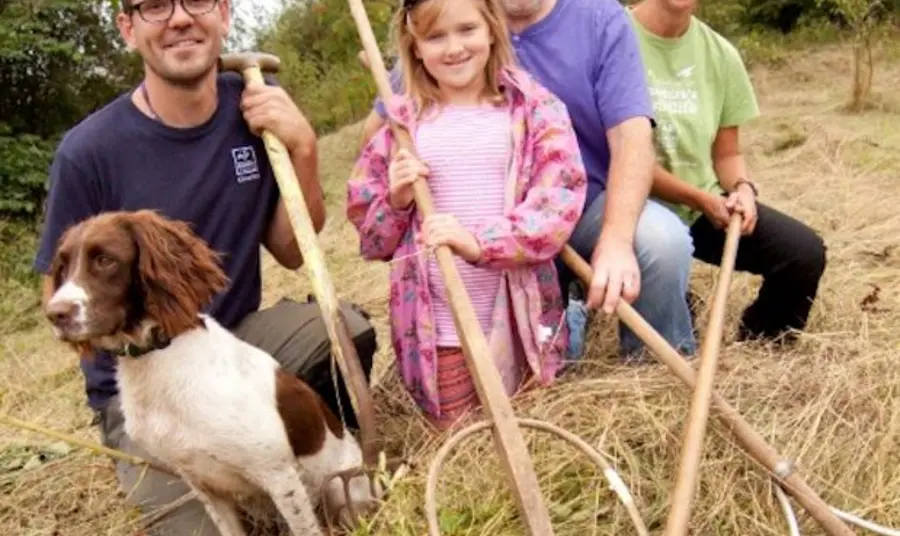 Volunteers at the Natural Futures project with tools used to maintain the natural environment