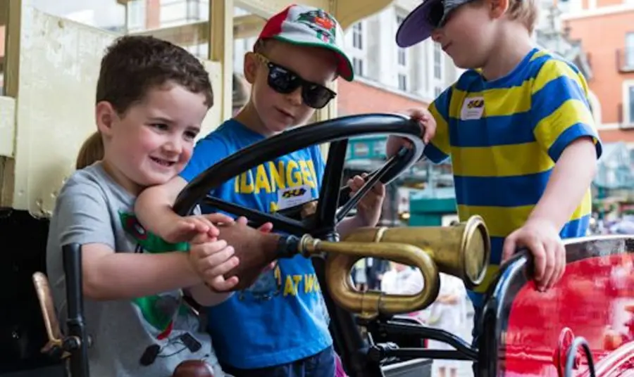 Children playing with one of the Battle Buses