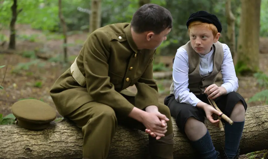Soldier comforts the son of an executed soldier. A still from ‘After Dawn’, the film created by young people at Central Youth Theatre