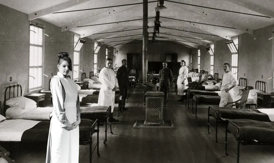 Participant as a VAD (Voluntary Aid Detachment) nurse in front of a green screen with an image of a First World War hospital