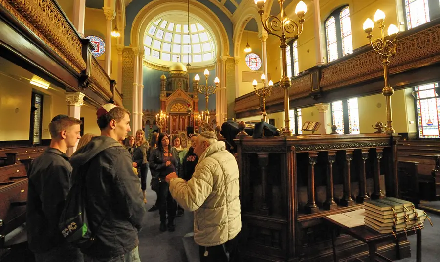 People being shown inside Garnethill Synagogue, Glasgow