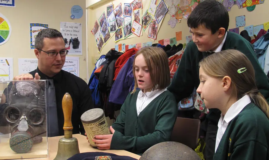 Children viewing First World War objects at a Green Howards Museum outreach event