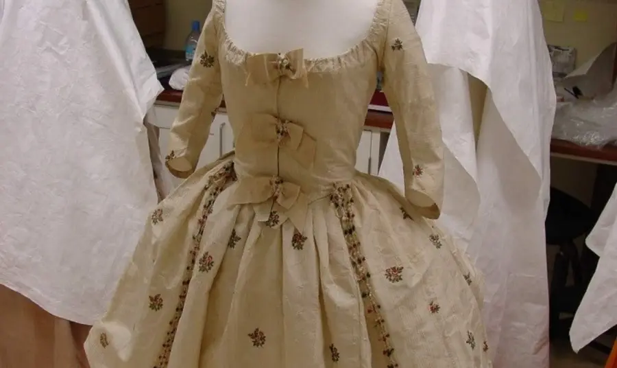 A crinoline-style skirt and matching bodice, in white cotton gauze with extensive beetle wing embroidery 