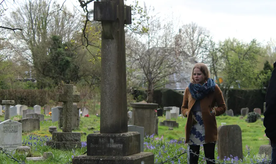 Student Holly Patrick, presenter of the Havant’s Heroes film at the grave of Sir Frederick Fitzwygram, one of the soldiers featured in the film