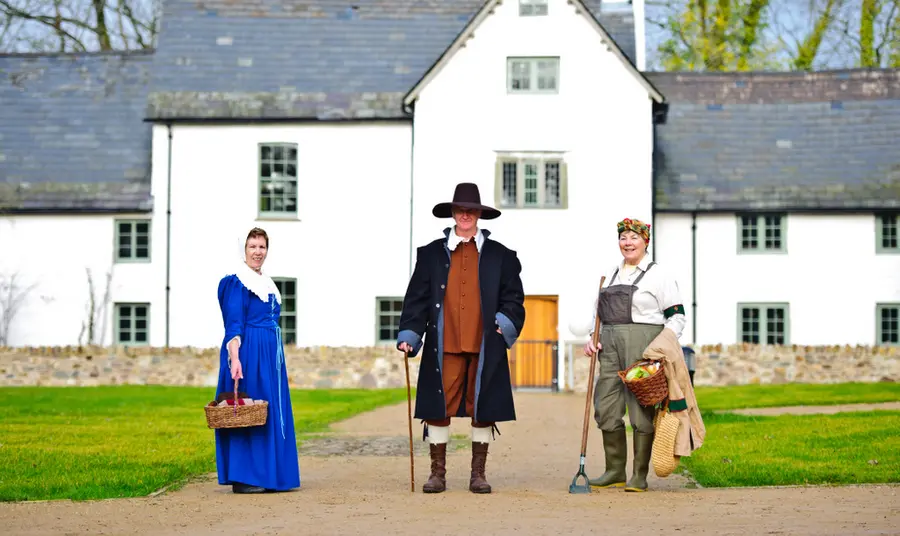 People in costume outside Llanyrafon Manor Rural Heritage Centre