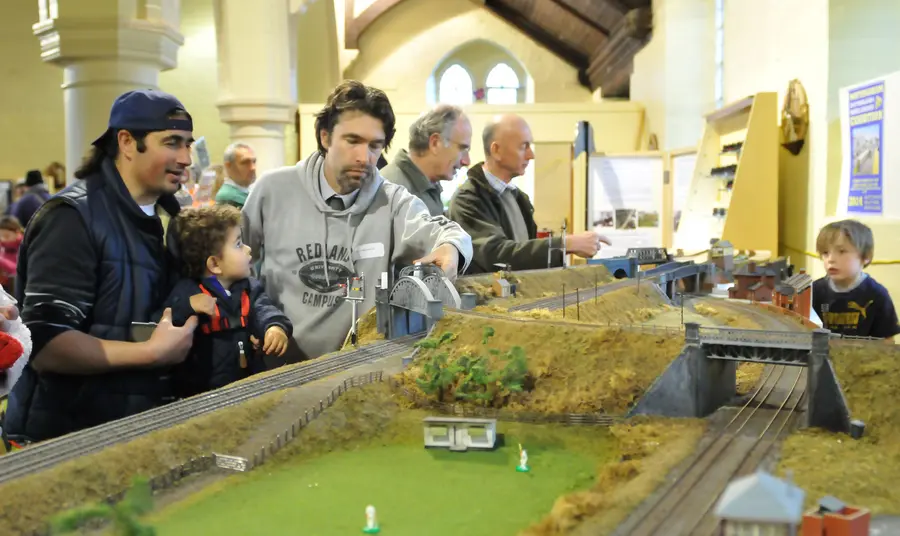 People look at a model railway