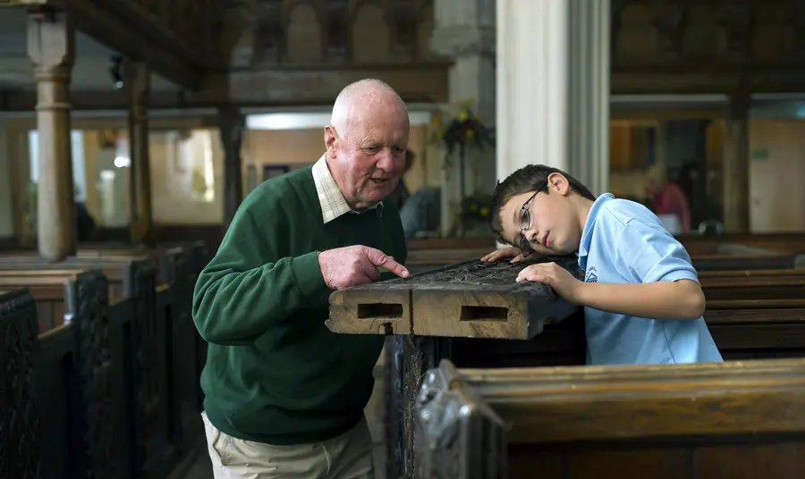 Volunteers worked with the local school children to learn about woodcarving.