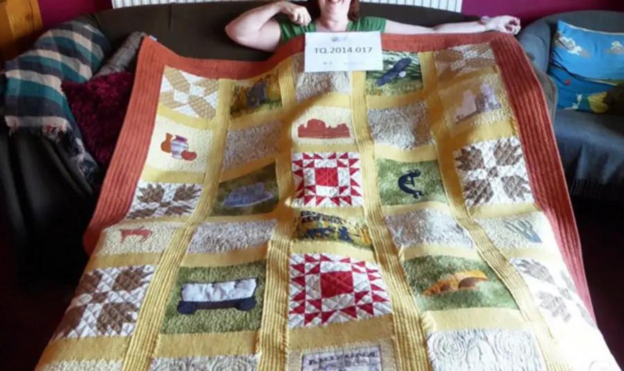 Interviewee Julie Edwards and her quilt